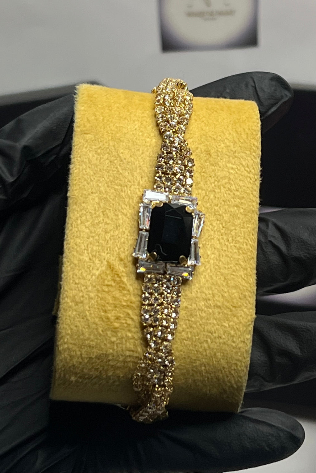 Luxury Gold Crystal Twist Bracelet with Black Emerald-Cut Center Stone