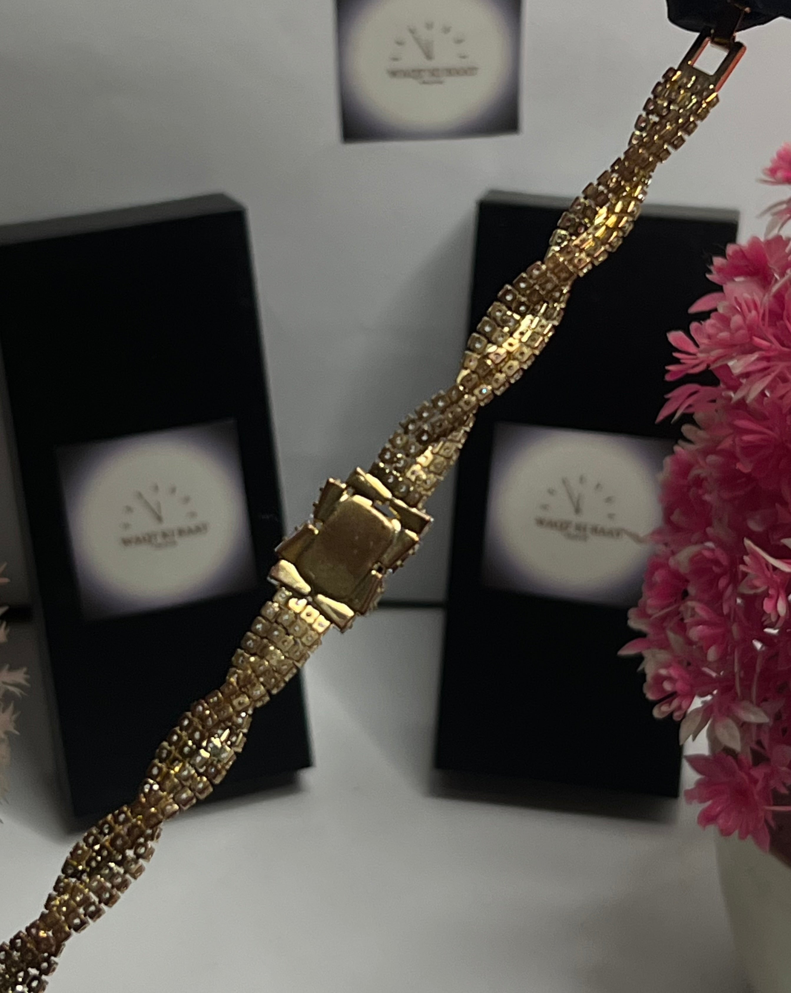 Luxury Gold Crystal Twist Bracelet with Black Emerald-Cut Center Stone