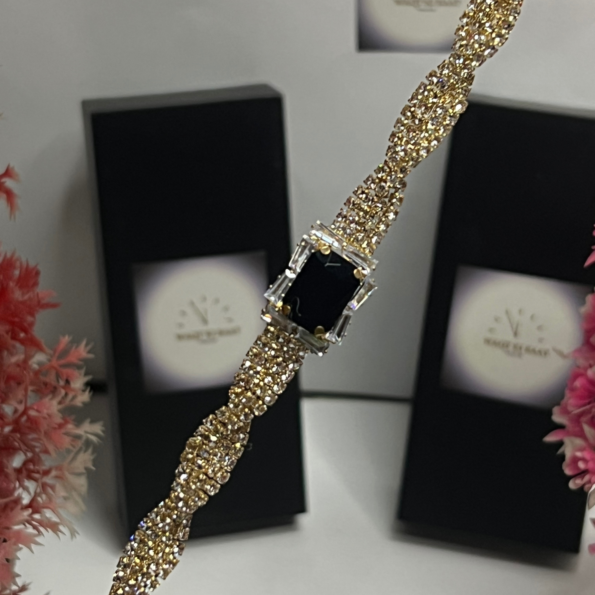 Luxury Gold Crystal Twist Bracelet with Black Emerald-Cut Center Stone